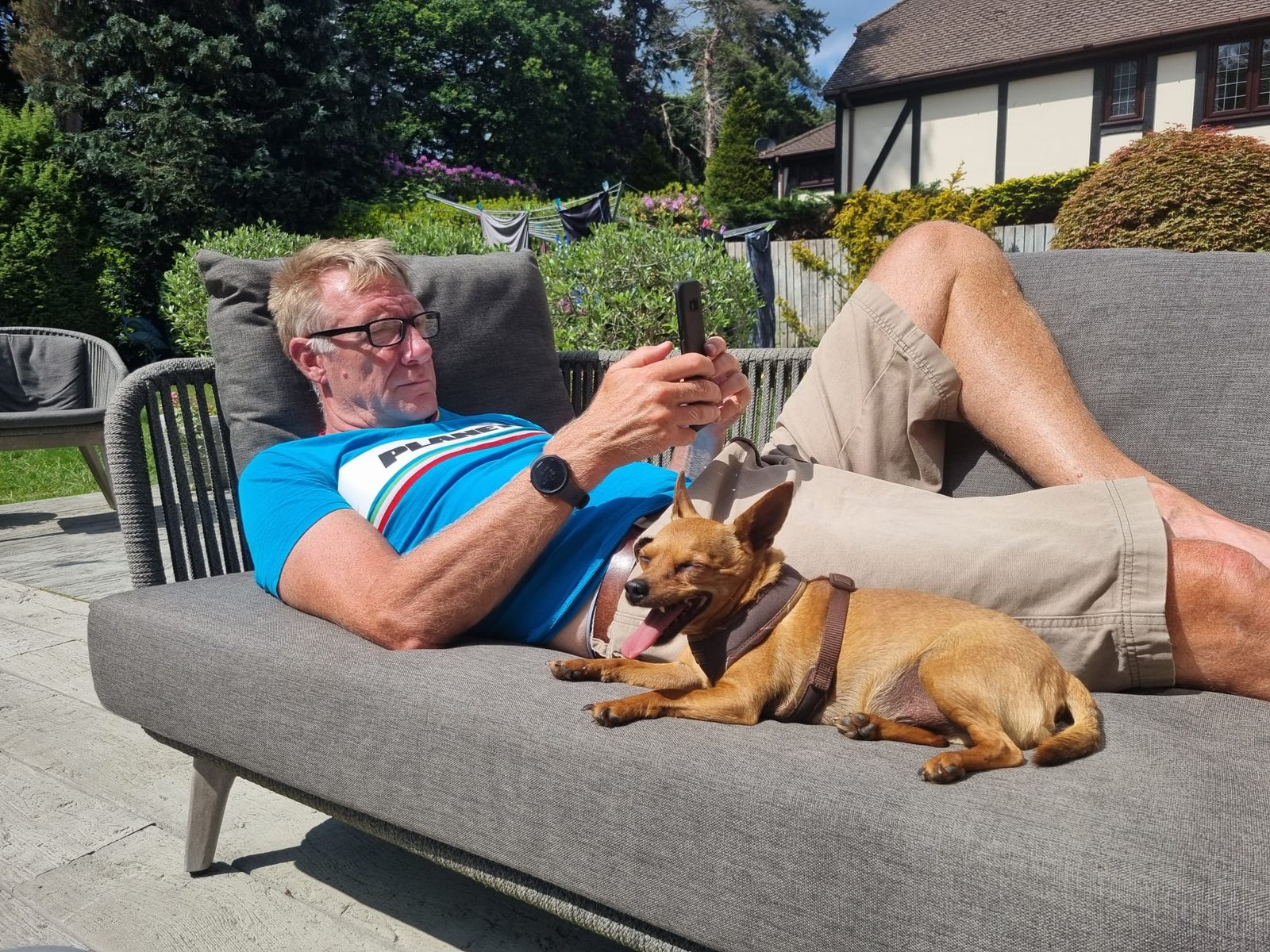 Carl playing with a dog at a client's home