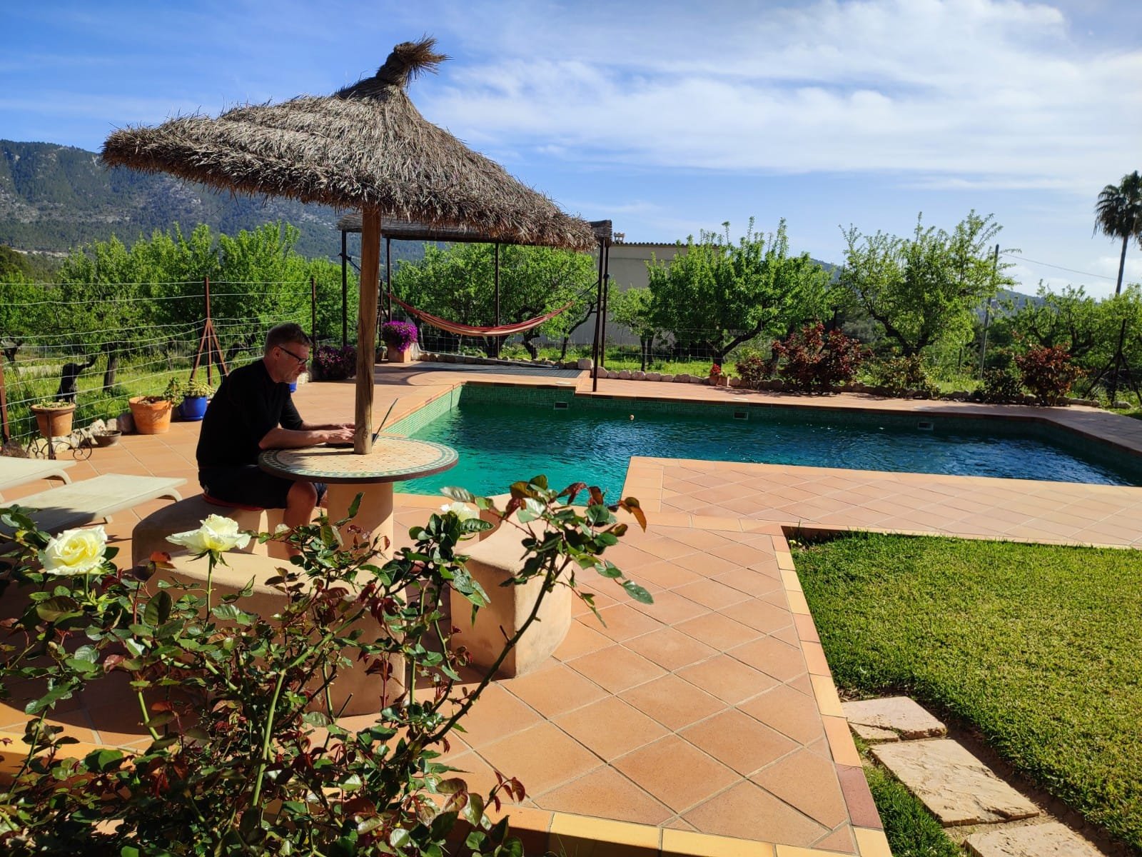 Carl working remotely while pet sitting at a property abroad