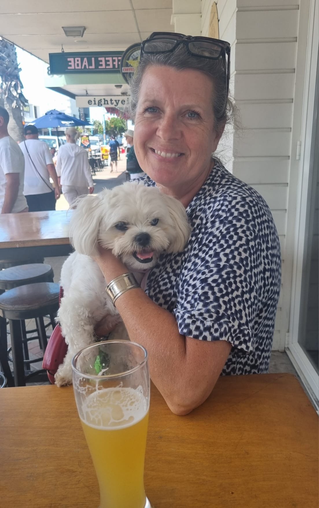 Louise sitting with a dog during a pet sitting visit